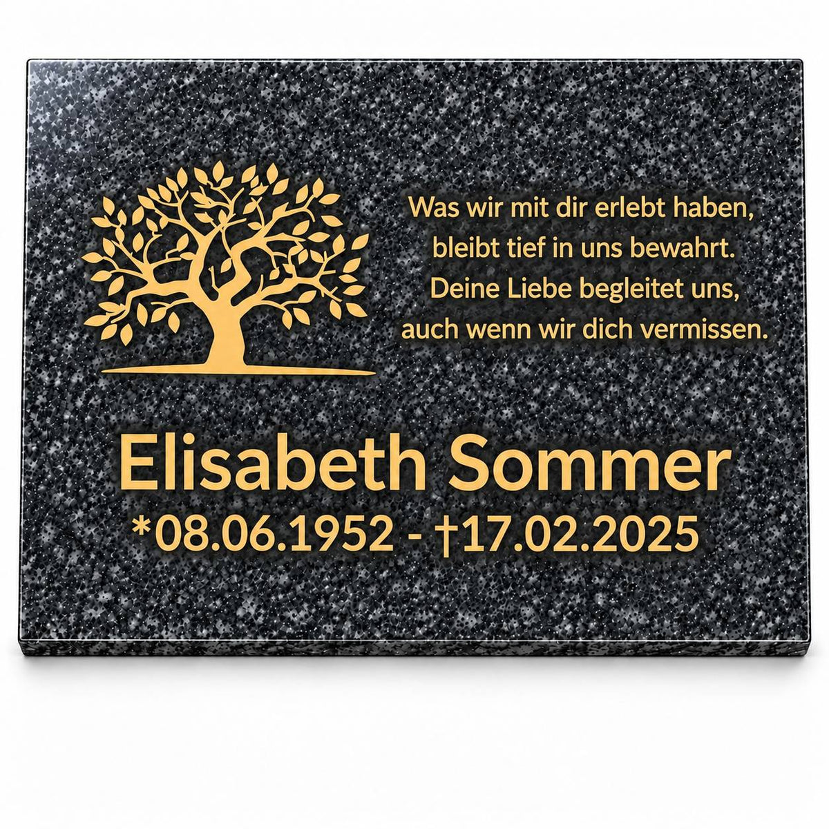 Personalisierte Gedenktafel aus Impala-Granit mit goldenem Lebensbaum, Namen, Lebensdaten und Gedenkspruch auf weißem Hintergrund.