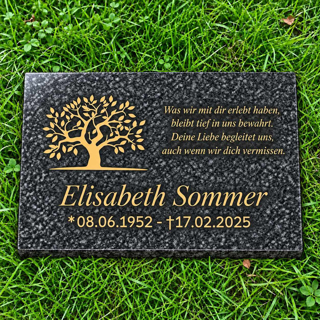 Graue Granit-Gedenktafel Impala mit goldenem Lebensbaum, personalisiertem Namen, Datum und Gedicht auf grünem Rasen.